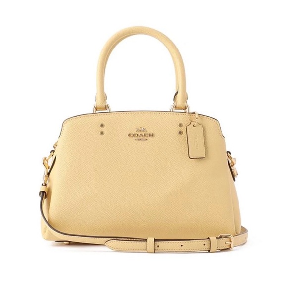 Coach Handbags - Coach Pebbled Leather Satchel in Light Yellow